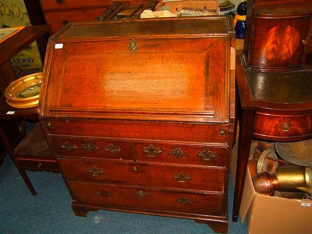 Appraisal: A Georgian oak bureau with two short and two long