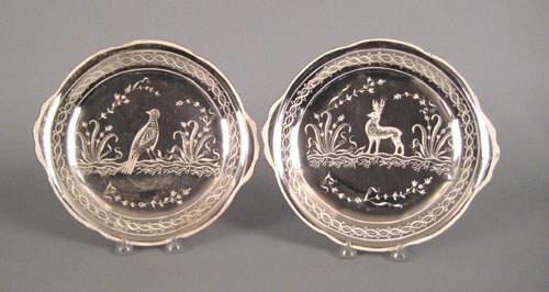 Appraisal: Two English silver resist plates th c with bird and