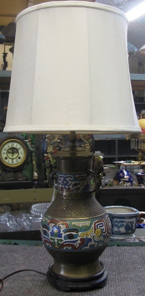 Appraisal: A CHINESE CHAMPLEVE ENAMEL TABLE LAMP having figural brass applied