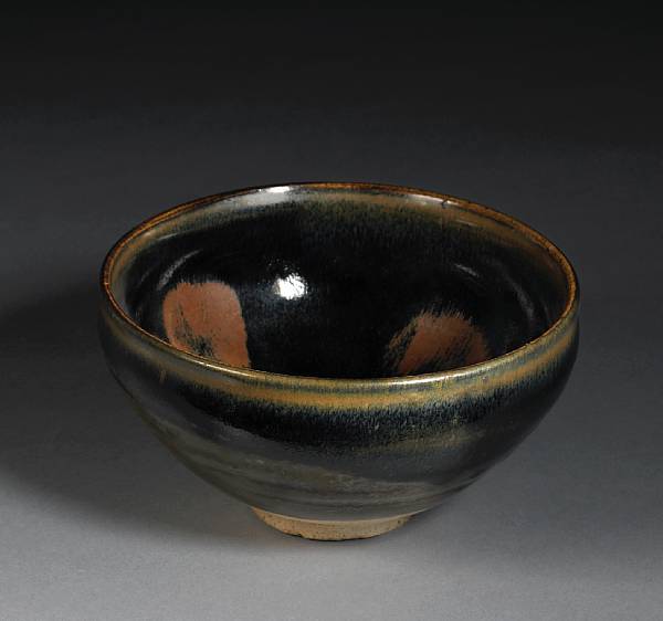 Appraisal: A Cizhou type black glazed stoneware tea bowl with russet