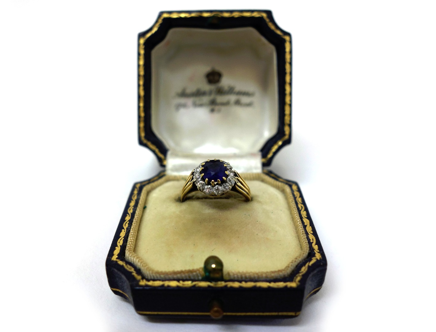 Appraisal: A sapphire and diamond cluster ring the round mixed-cut sapphire