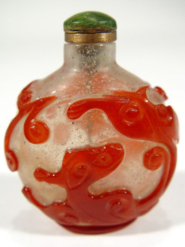 Appraisal: Chinese overlaid glass scent bottle with red dragon decoration cm