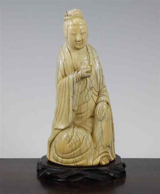 Appraisal: A Chinese ivory seated figure of Guanyin in Ming style