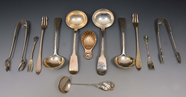 Appraisal: Pair of silver pickle forkstogether with a collection of four