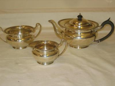 Appraisal: A THREE PIECE TEA SET of waisted circular form the