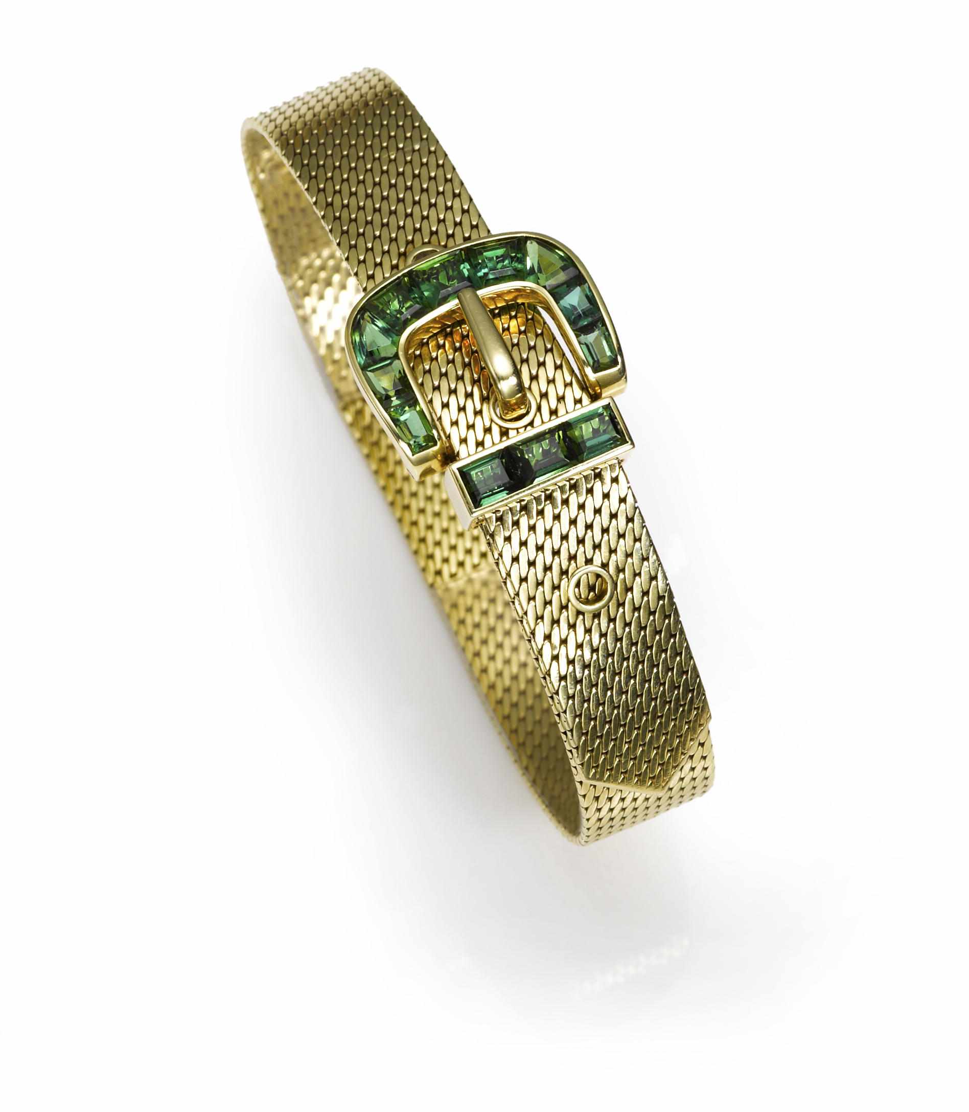 Appraisal: A green tourmaline and fourteen karat gold buckle bracelet signed