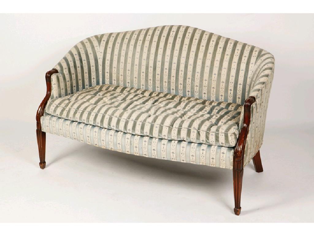 Appraisal: A VICTORIAN UPHOLSTERED TWO SEATER SOFA the arched and curved