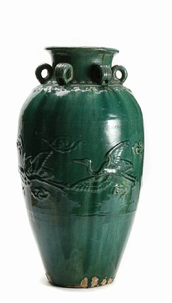 Appraisal: A Chinese green glazed trade jar with crane and lion