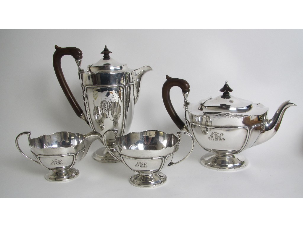 Appraisal: A silver four piece tea service the panelled sides with