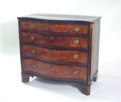 Appraisal: A George III mahogany serpentine front chest the crossbanded top