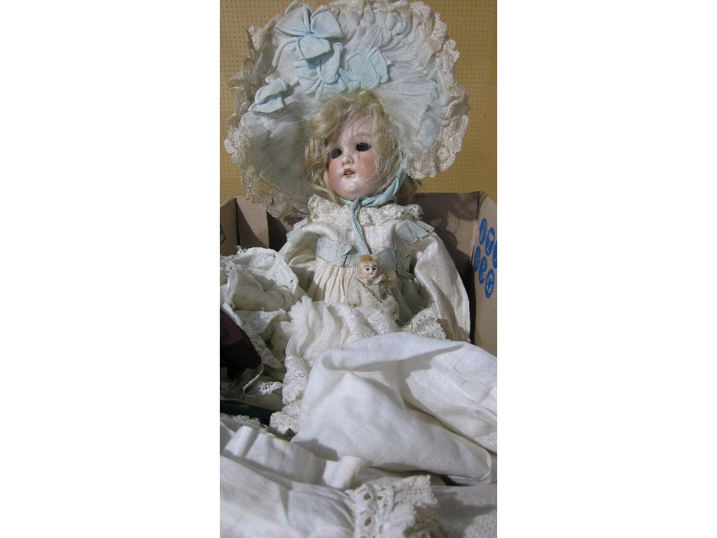 Appraisal: Lot comprising girl doll a quantity of clothes and a