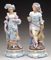 Appraisal: PAIR OF PORCELAIN FIGURINES Colorful man and woman figurines are