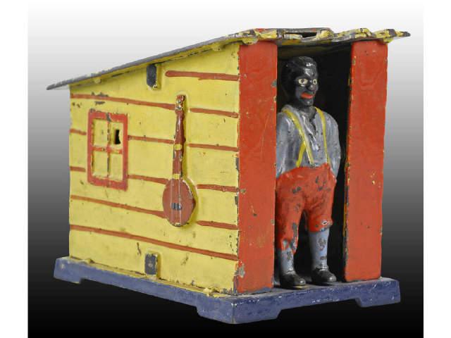 Appraisal: Cast Iron Cabin Mechanical Bank Description paint No trap Works