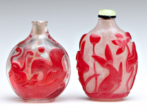 Appraisal: CHINESE SNUFF BOTTLES Two glass bottles one ruby-red overlay bubble-suffused