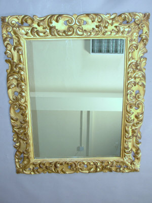 Appraisal: A carved giltwood wall mirror th century of rectangular form