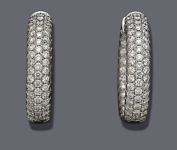 Appraisal: A pair of diamond and eighteen karat white gold hoop