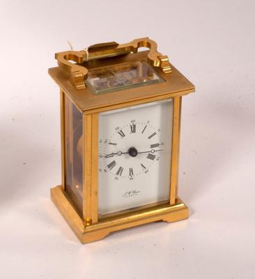 Appraisal: A gilt brass cased carriage clock the white enamel dial