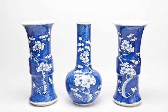 Appraisal: A CHINESE GARNITURE OF THREE BLUE GROUND VASES each with