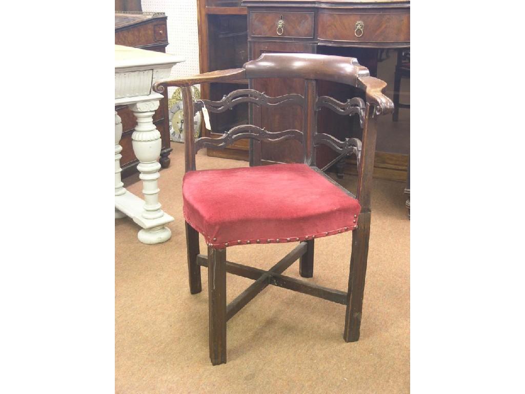 Appraisal: A George III mahogany corner-fitting elbow chair ladder-back with cresting