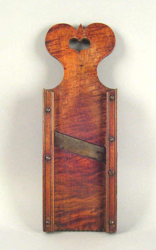 Appraisal: Pennsylvania tiger maple slaw board th c with heart cutout