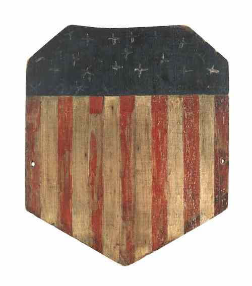 Appraisal: Two wooden carved and painted American shields with red white