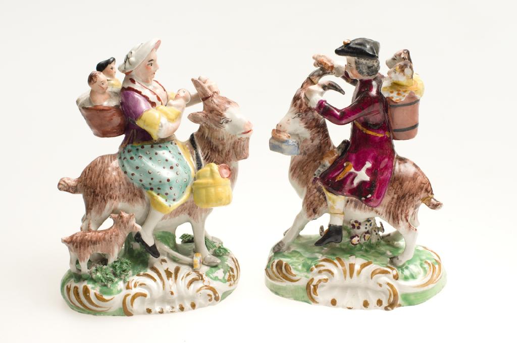 Appraisal: PAIR OF STAFFORDSHIRE FIGURES OF THE WELSH TAILOR AND HIS