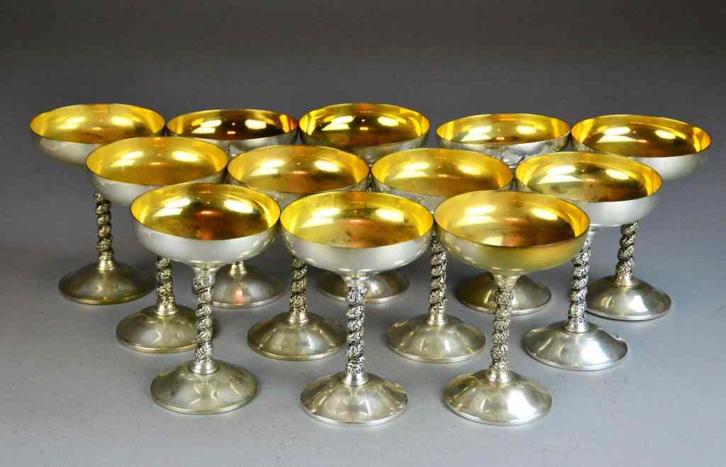 Appraisal: Champagne Glasses - Goldwash InteriorSilverplate champagnes with spiral grape and