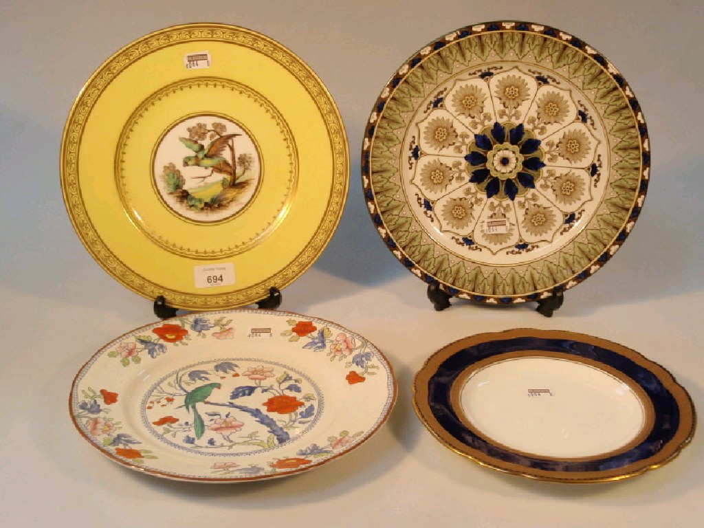 Appraisal: A Wedgwood yellow ground cabinet plate painted with a parrot