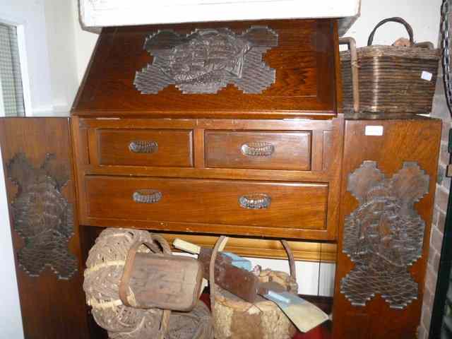 Appraisal: A HARDWOOD BUREAU with bookcases to either side and with