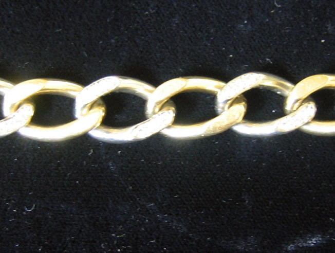 Appraisal: GOLD CHAIN BRACELET WITH DIAMONDS k yellow gold curb link