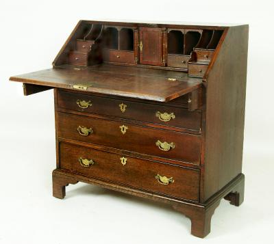 Appraisal: A GEORGE III OAK BUREAU th century the fall front