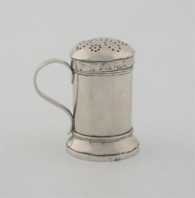 Appraisal: A George III kitchen pepper scroll handle skirted base possibly