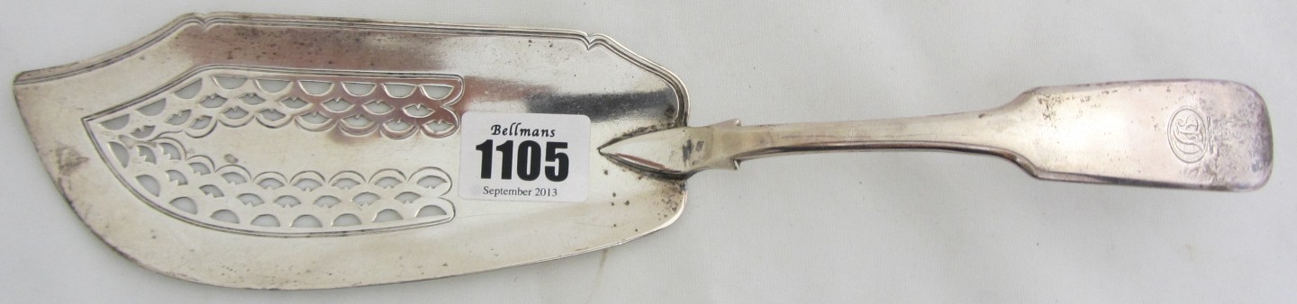 Appraisal: A silver fiddle pattern fish slice with pierced decoration London