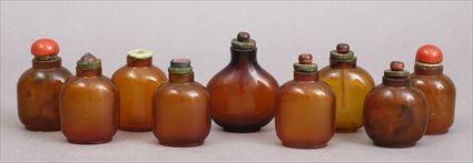 Appraisal: GROUP OF NINE PEKING AMBER GLASS SNUFF BOTTLES AND ASSOCIATED