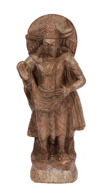 Appraisal: AN INDIAN LARGE STONE FIGURE OF SHIVA on a naturalistic