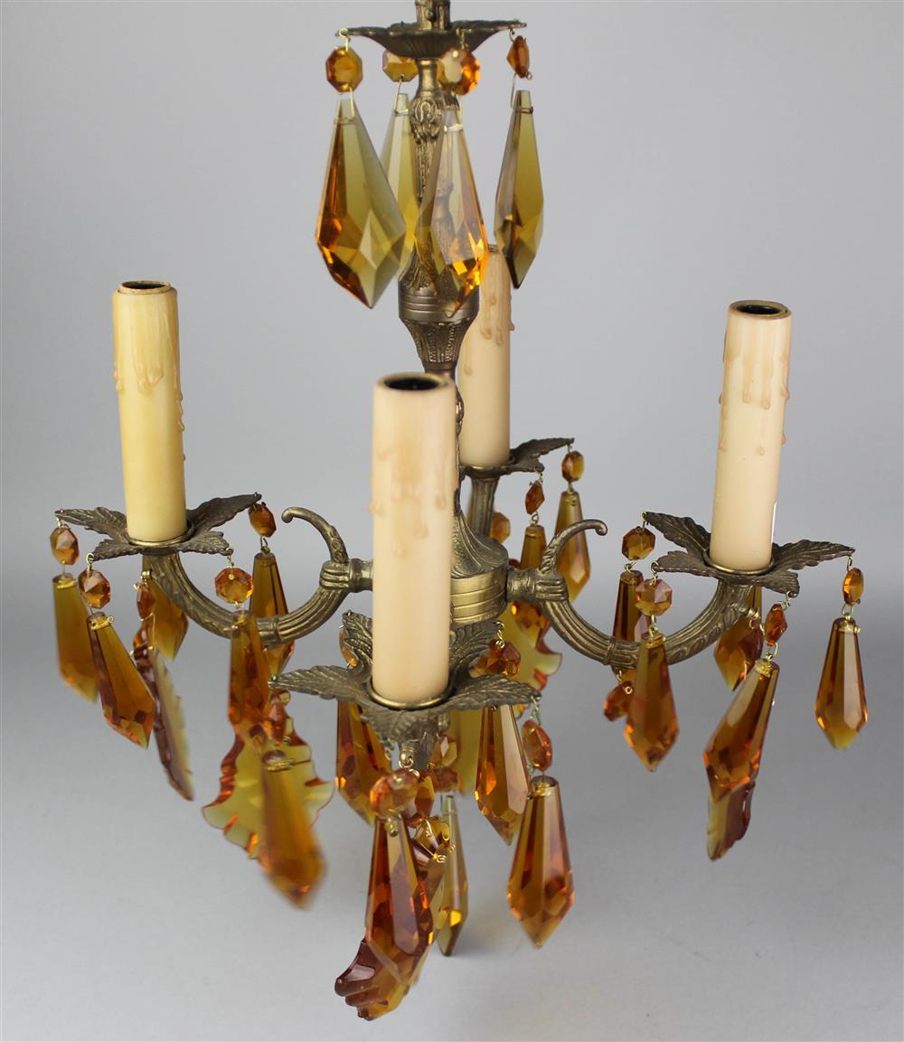 Appraisal: DIMINUTIVE BRONZE FOUR-LIGHT CHANDELIER SUSPENDED WITH AMBER GLASS PRISMS modeled