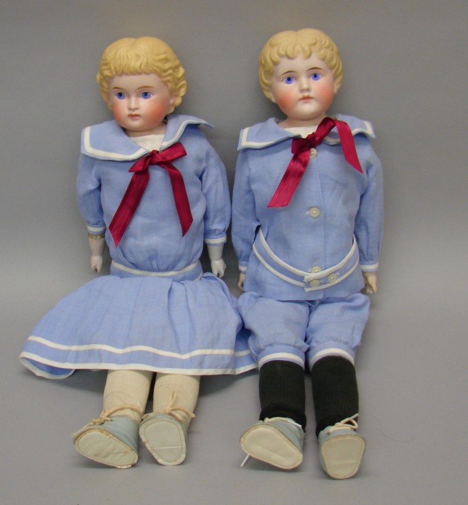 Appraisal: Pair of unmarked twin shoulderhead dolls with painted features and