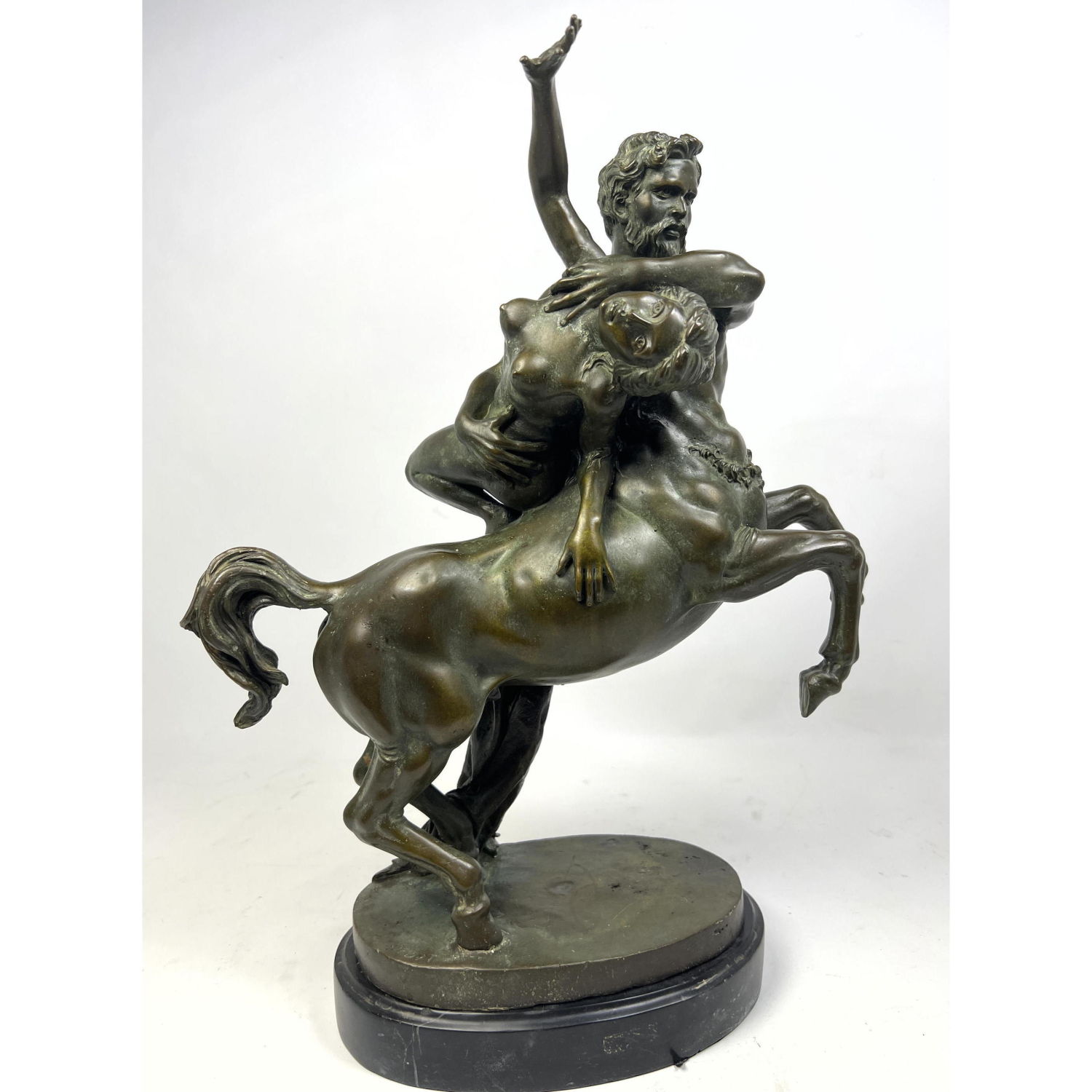 Appraisal: Classical style Bronze Sculpture Minotaur assaulting young woman Black base