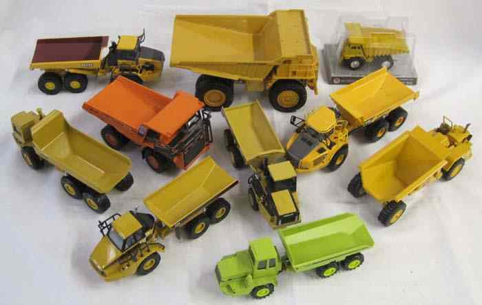 Appraisal: TEN DIECAST SCALE MODEL DUMP TRUCKS including Ertl Hitatch EH-