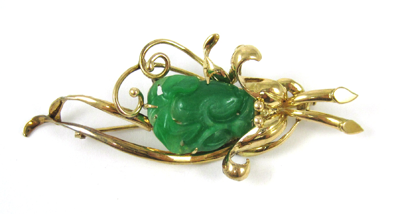 Appraisal: JADE AND FOURTEEN KARAT GOLD PIN with a green jade