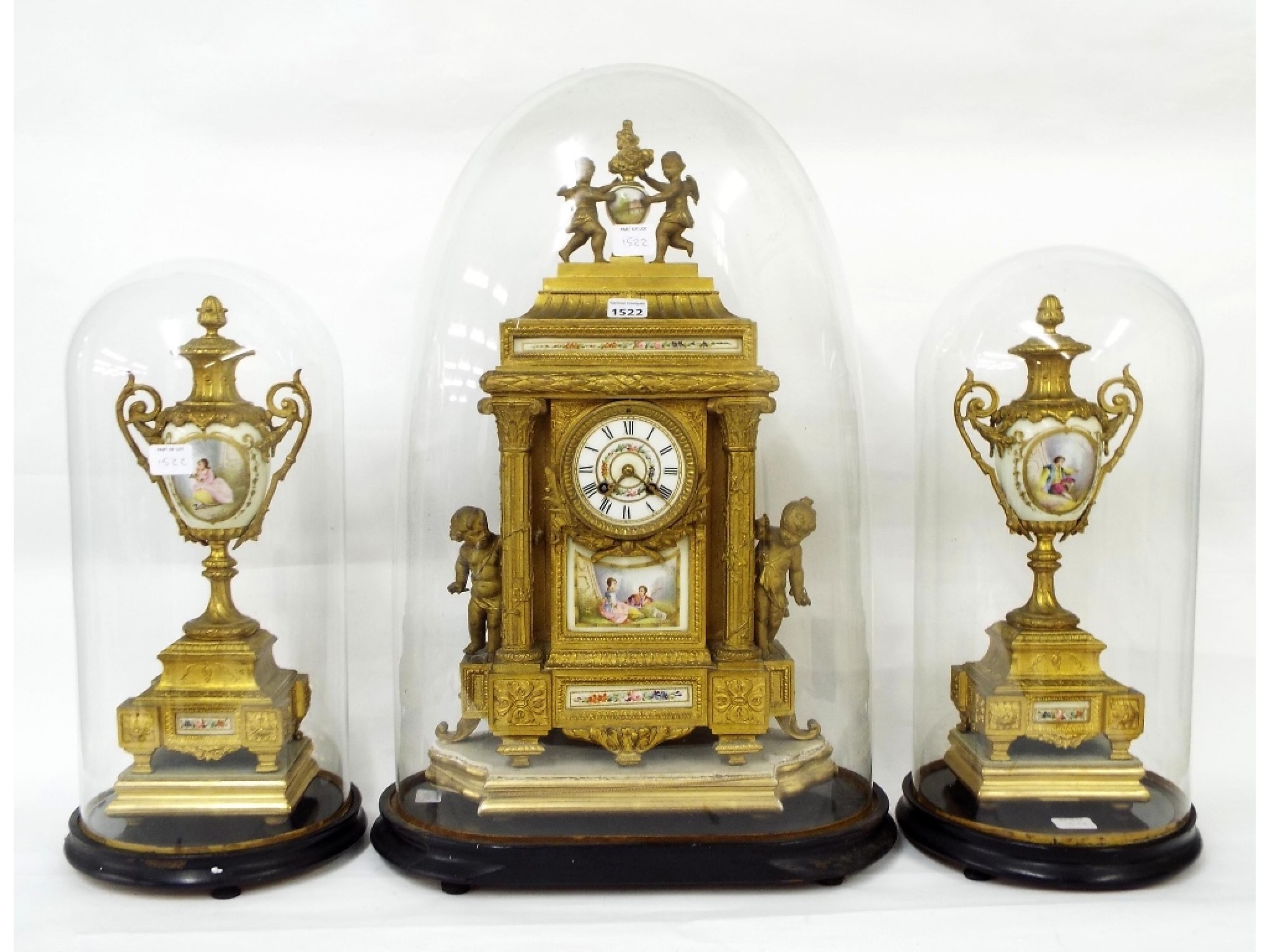 Appraisal: French gilt metal and porcelain mounted two train mantel clock