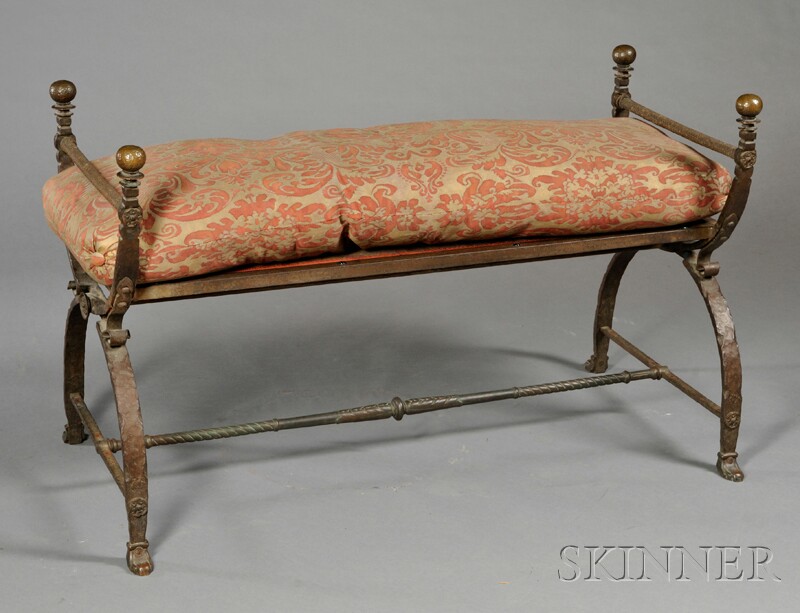 Appraisal: Iron Bench with Fortuny Cushion with two hammer-finished round finials