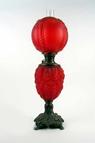 Appraisal: AN AMERICAN VICTORIAN OIL LAMP in red satin glass with