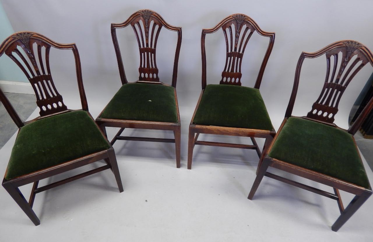 Appraisal: A set of four George III style mahogany dining chairs