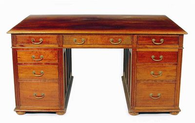 Appraisal: A walnut partner's pedestal desk the moulded edge top above