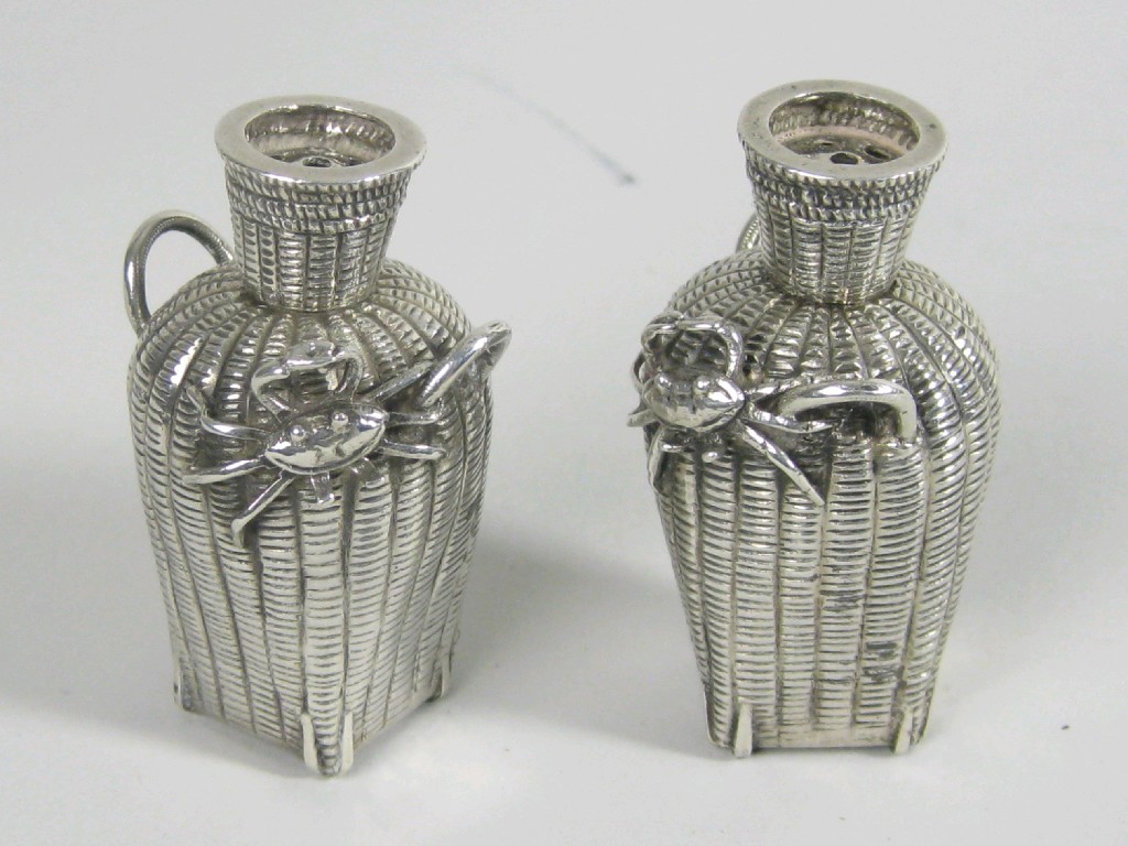 Appraisal: Pair of Chinese silver Pepperettes in the form of baskets