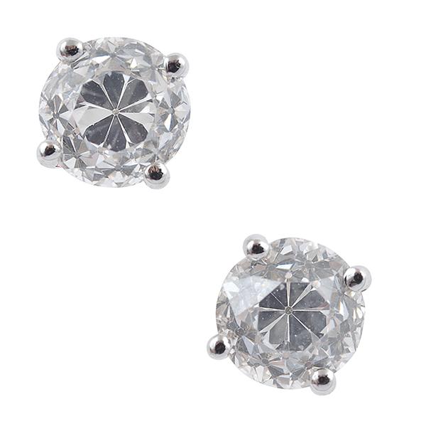 Appraisal: A PAIR OF DIAMOND STUD EARRINGS Each set with an