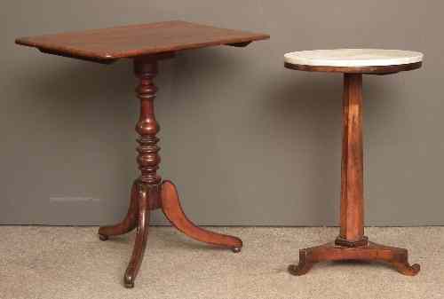 Appraisal: A late Georgian mahogany rectangular tripod table on turned centre