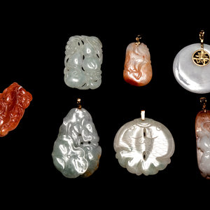 Appraisal: Seven Chinese Jadeite Pendants comprising a bi disc-form white jadeite