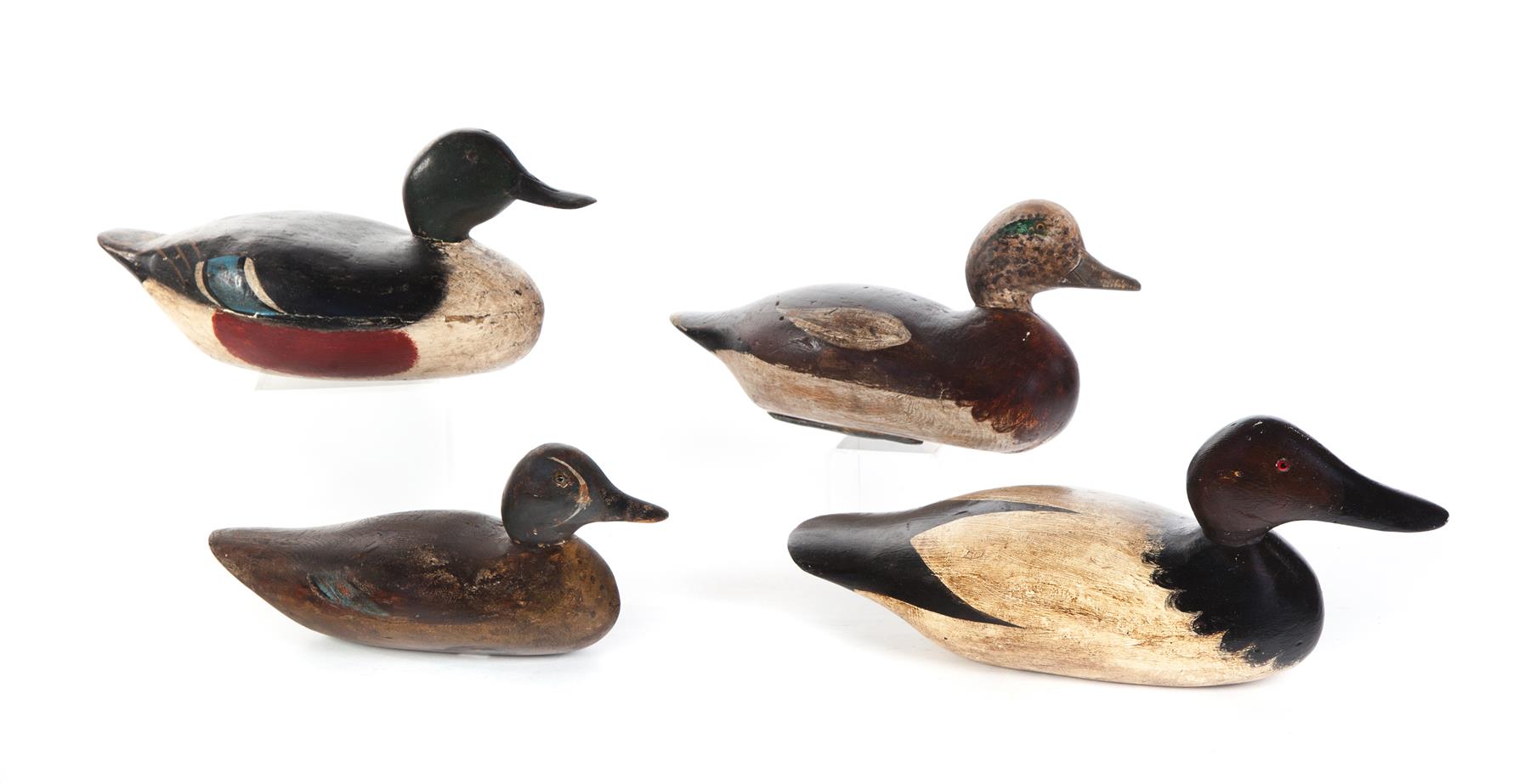 Appraisal: FOUR AMERICAN DUCK DECOYS Mid th century Old working paint